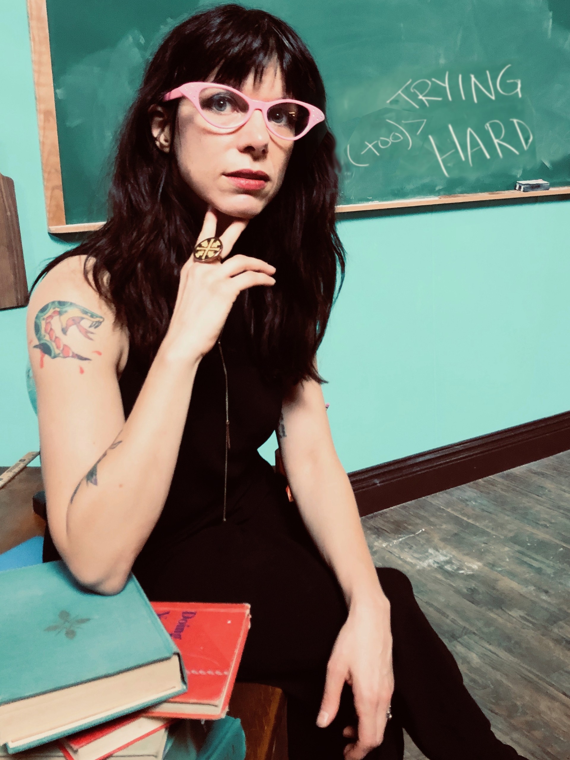sheila in front of a chalkboard
